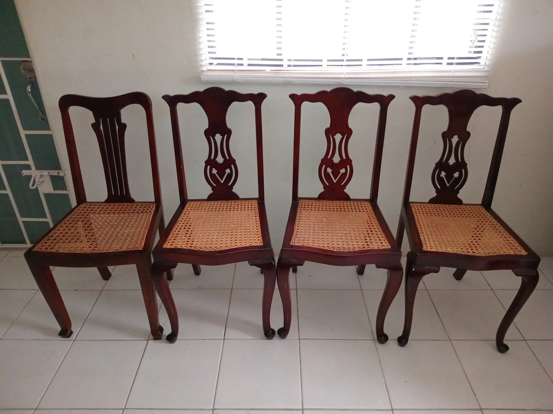 Restored wooden dining chairs with woven cane seats